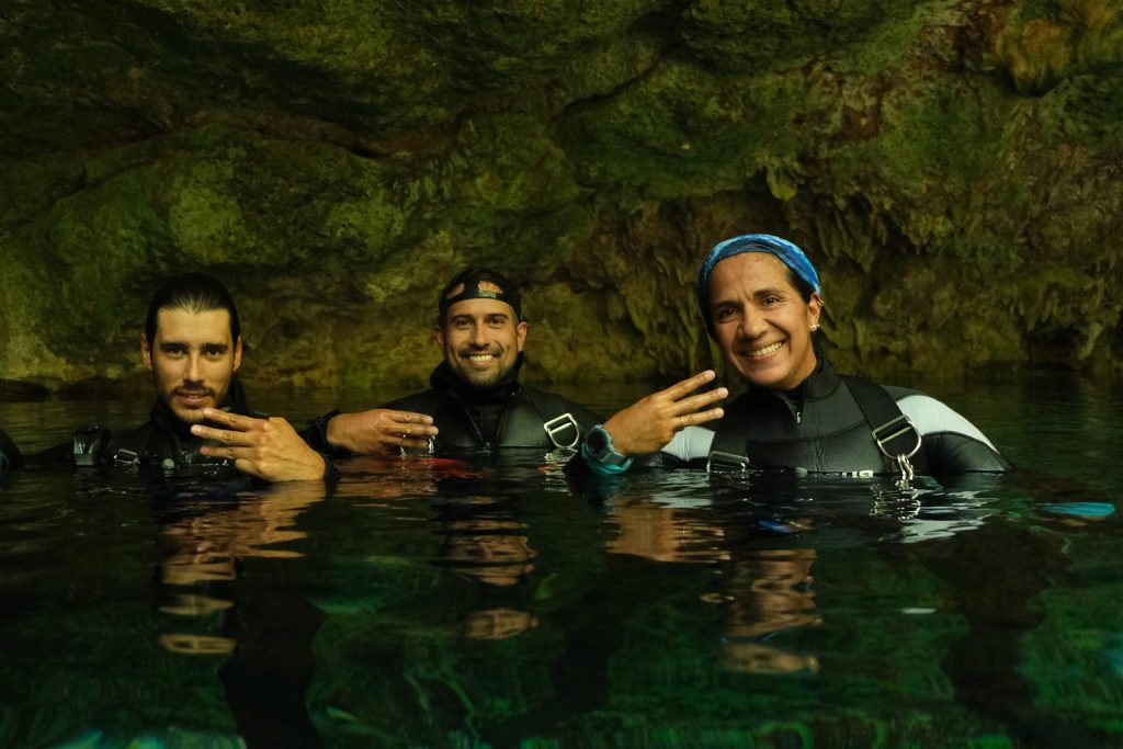 Alejandra Rodríguez, Adrián de la O and Mauricio Rodríguez, founders of The Dive Machine, in a cenote